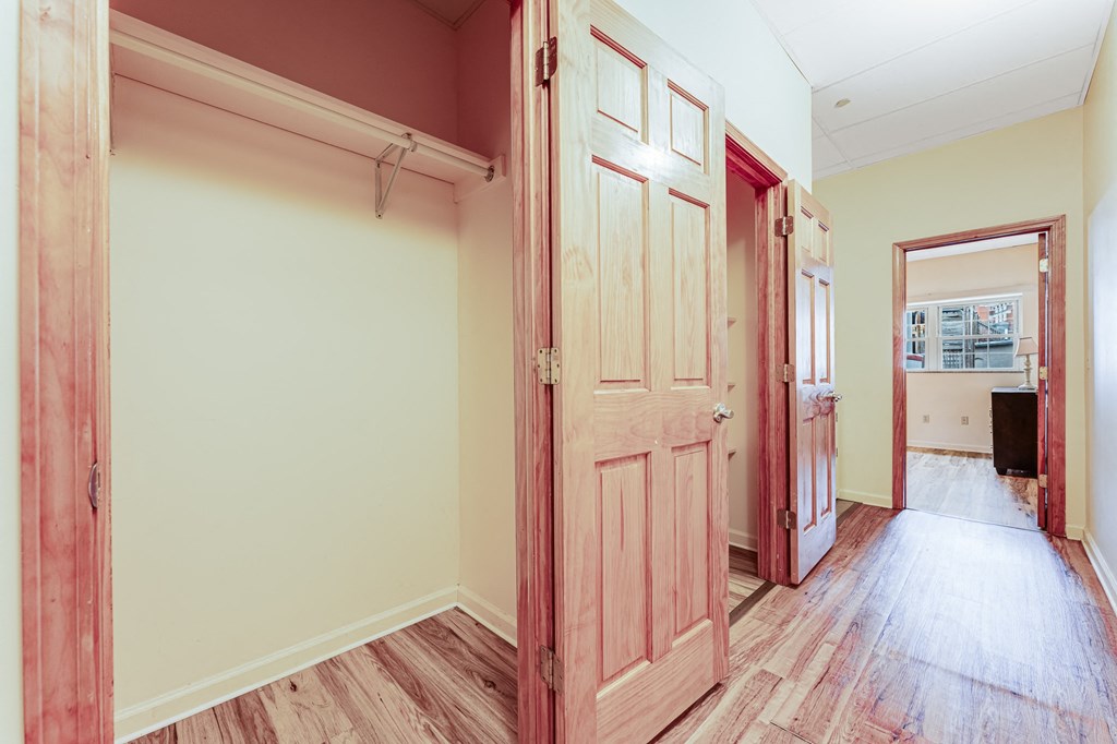 A room with a door and a window.