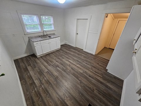 A kitchen with a sink and a window.