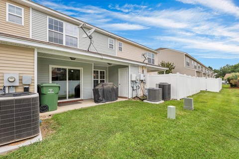 A sunny day at a residential area with houses and green lawns.