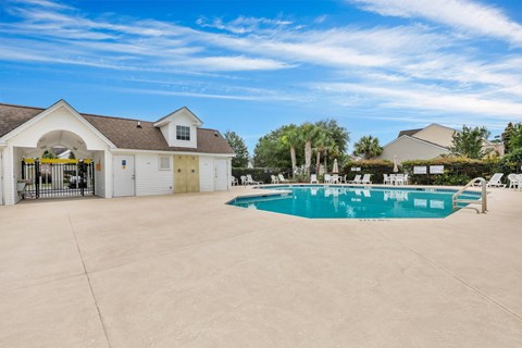 A large house with a pool in the backyard.