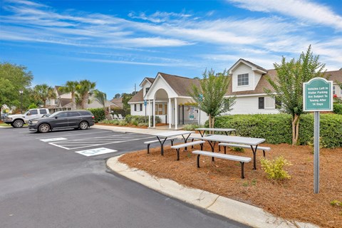 A sign in front of a house reads "Welcome to Lakeside Estates.".