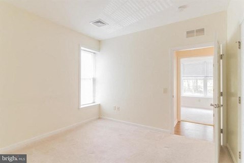 A room with a door and a window.