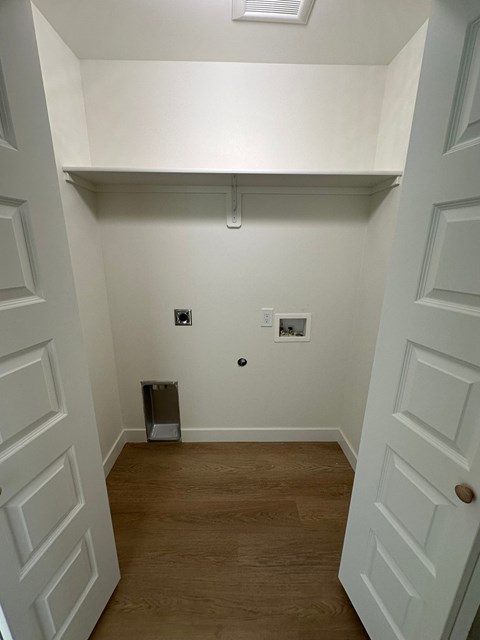 A white door is on the left and a white door is on the right.