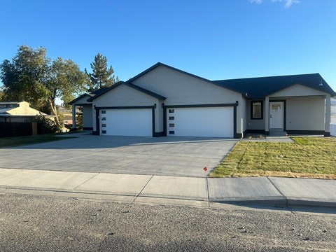 A two-car garage is attached to a house.