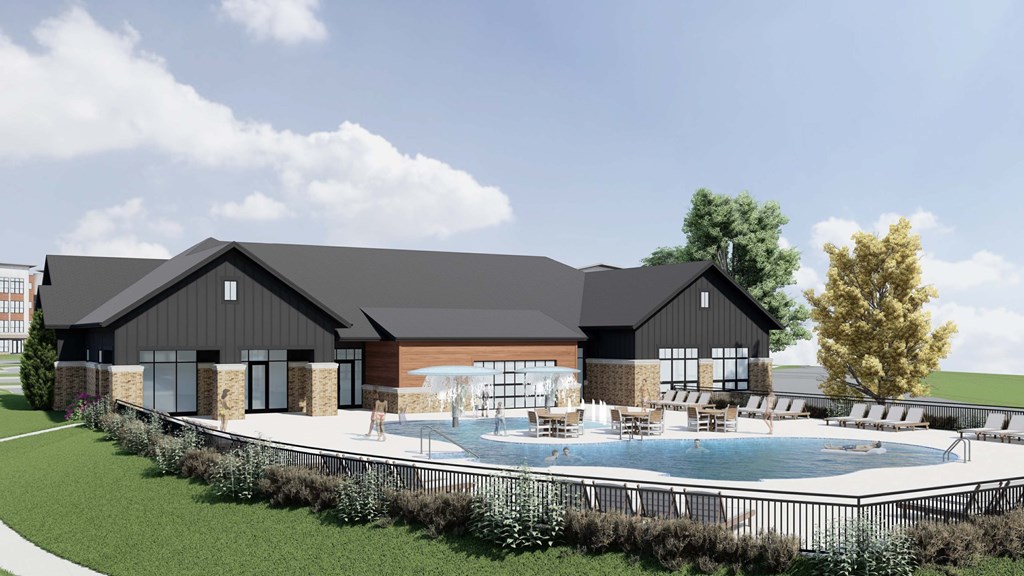 A modern building with a pool in front.