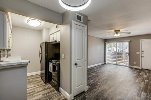 A kitchen with a refrigerator and a counter top.