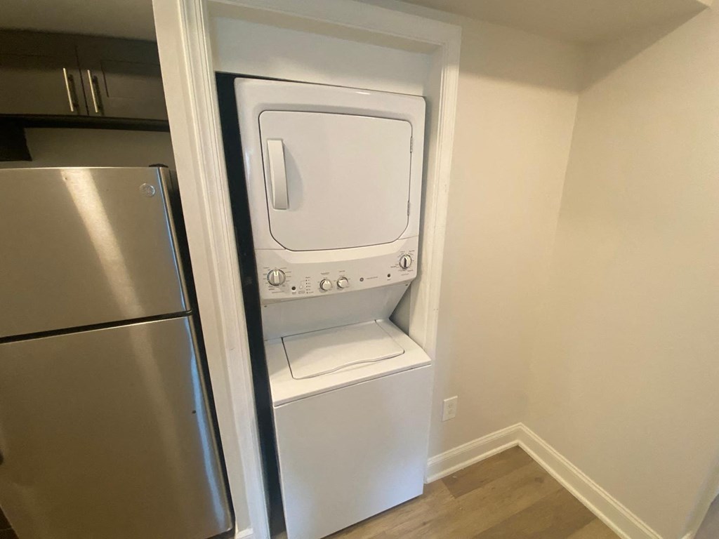 A white oven is built into a wall in a kitchen.