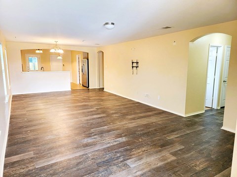 A room with wooden floors and a white counter.