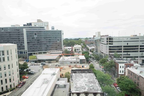 A city street with cars and buildings.