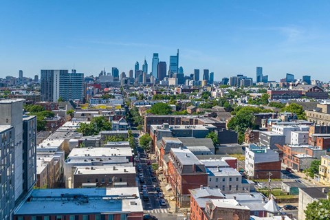 A cityscape with a mix of residential and commercial buildings.