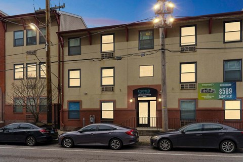 A building with a sign that says "Owned" and a price of $599.