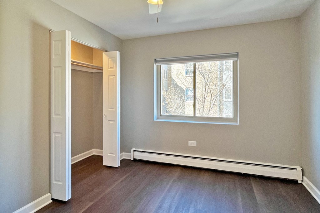 A room with a window and a door.