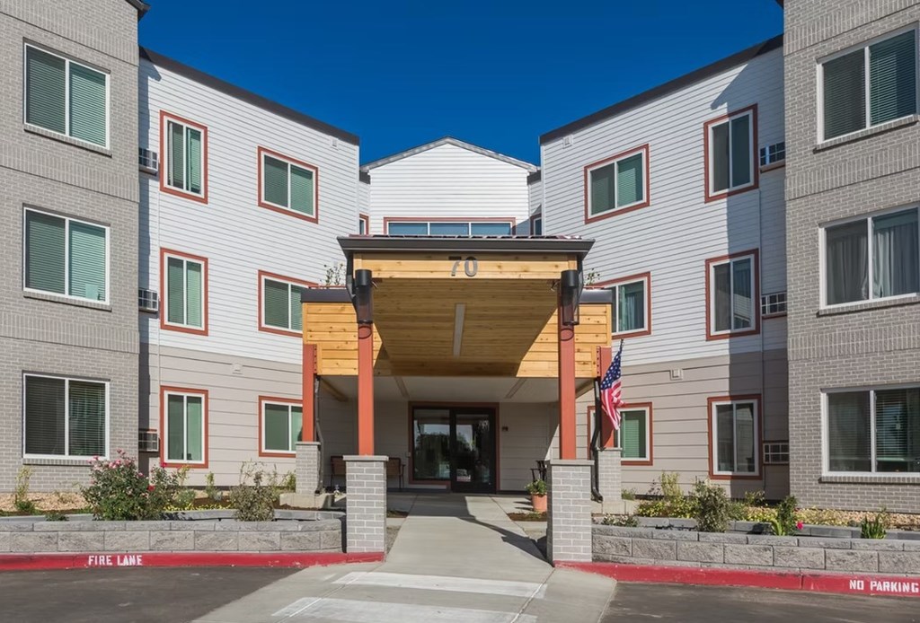 A building with a red and white striped awning in front of it.