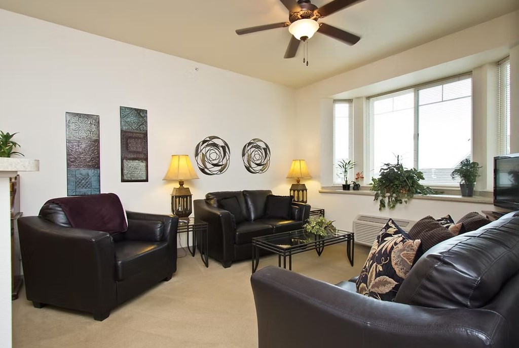 A living room with a fireplace and a couch.