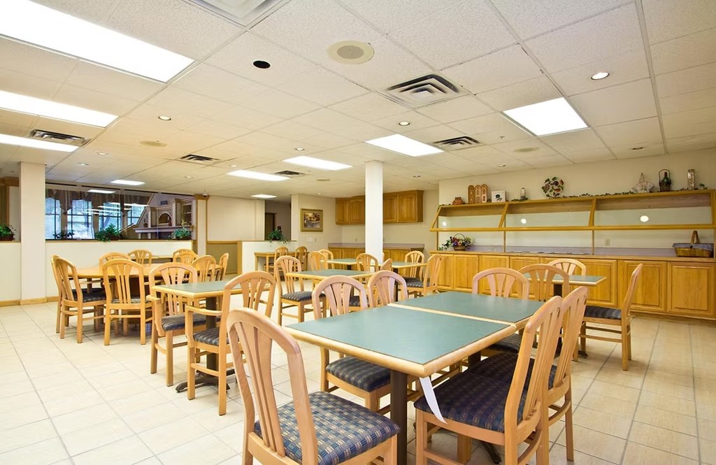 A large room with tables and chairs.
