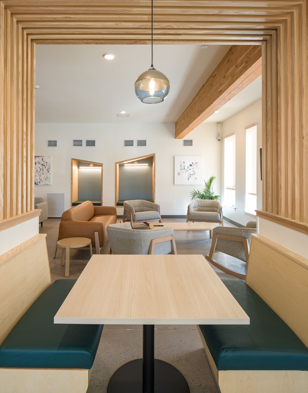 A room with a long table and chairs.