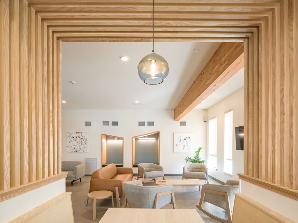 A modern living room with wooden accents and furniture.