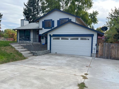 A two-story house with a garage.