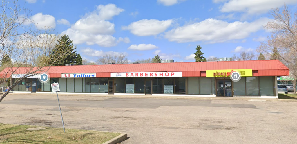 A barbershop is located in a strip mall.