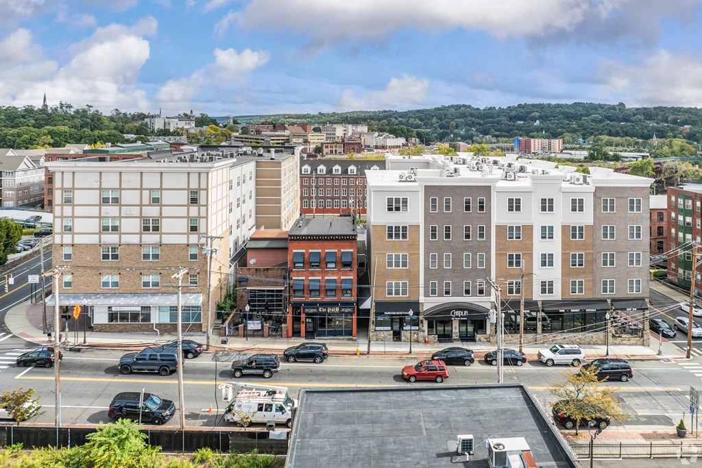 A city street with cars and buildings.