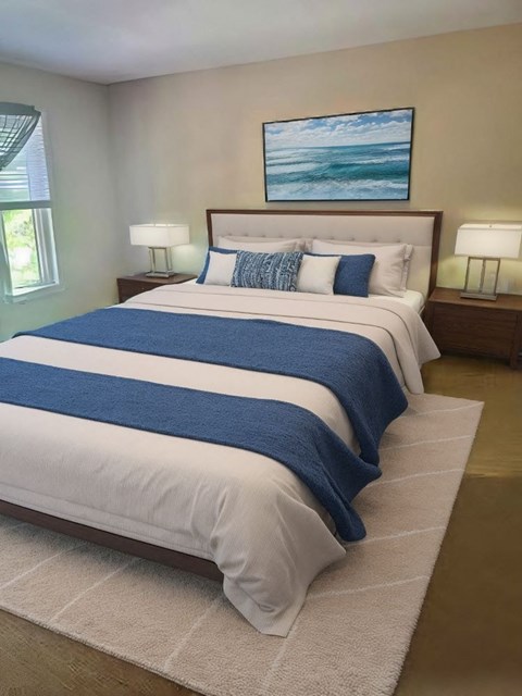 A bedroom with a large bed and a painting on the wall.