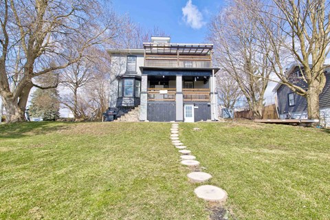 A house with a path leading to the front door.