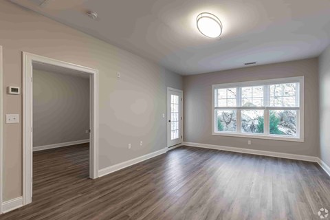 A room with a window and a door.