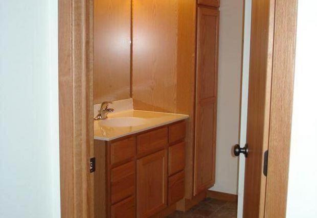 a small bathroom with a sink and a door