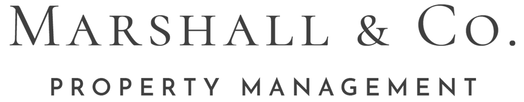 A black and white image of a company logo for Marshall & Co. Property Management.