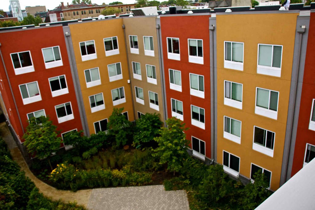 A building with red and yellow balconies.