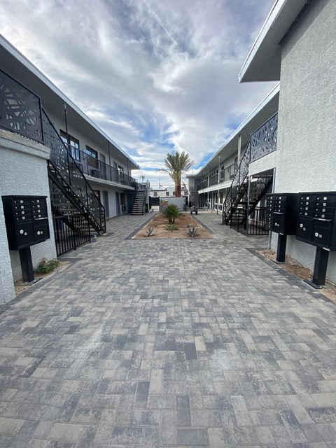 A long, narrow walkway with black railings on both sides.