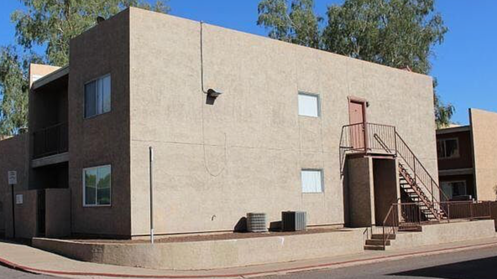 A building with a red fire escape.