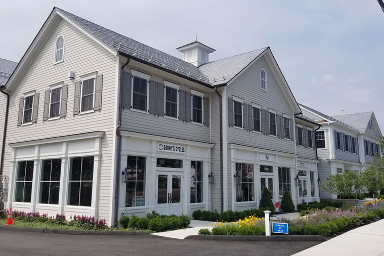 A white building with a sign that says "Amity Grove".