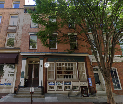 A brick building with a sign that says "M Street Professional Building.".