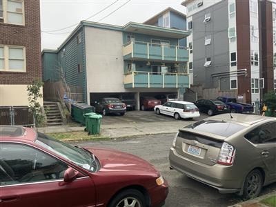 A red car is parked in a parking lot.