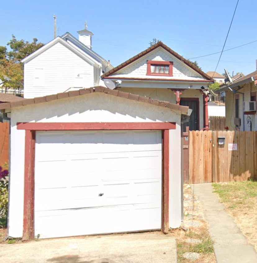 A white garage door is closed.