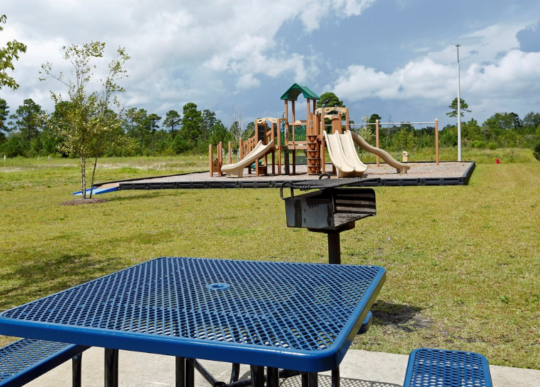 a playground with slides on a picnic table