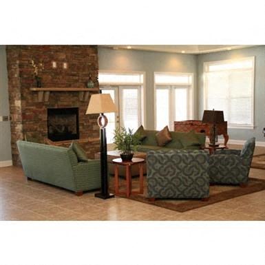 a living room with a couch and a fireplace