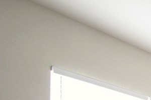 a bedroom with a bed and a ceiling fan