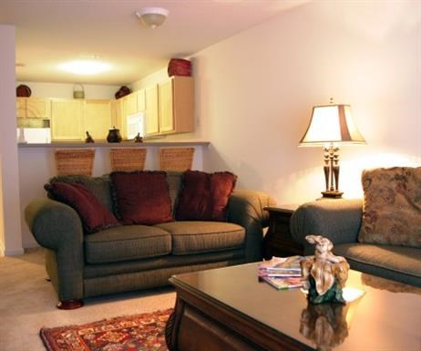 a living room with couches and a table