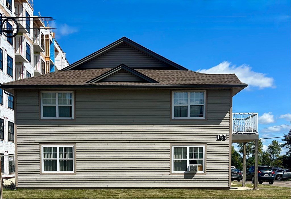 A house with the number 155 on the front.