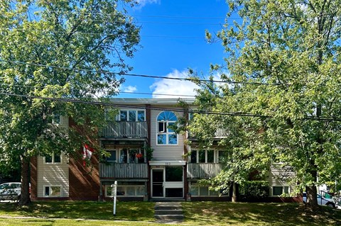 A two-story building with a balcony on the second floor.