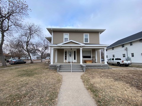 A house with a front porch and a driveway.