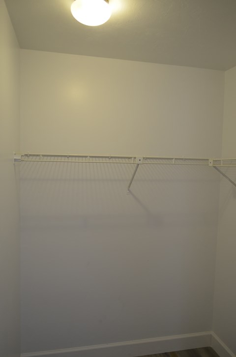 A white wall with a light on it.
