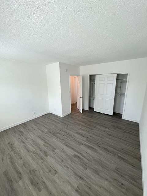 A room with a grey floor and white walls.