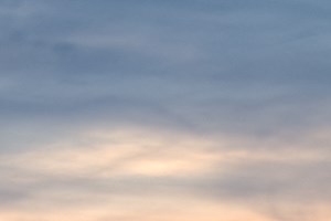 a view of a house with a sunset in the background