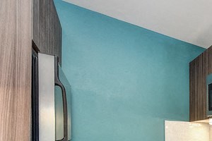 Apartments in Sunnyvale for Rent - Kitchen with Stainless Steel Appliances, Wood Flooring, and Tiled Backsplash
