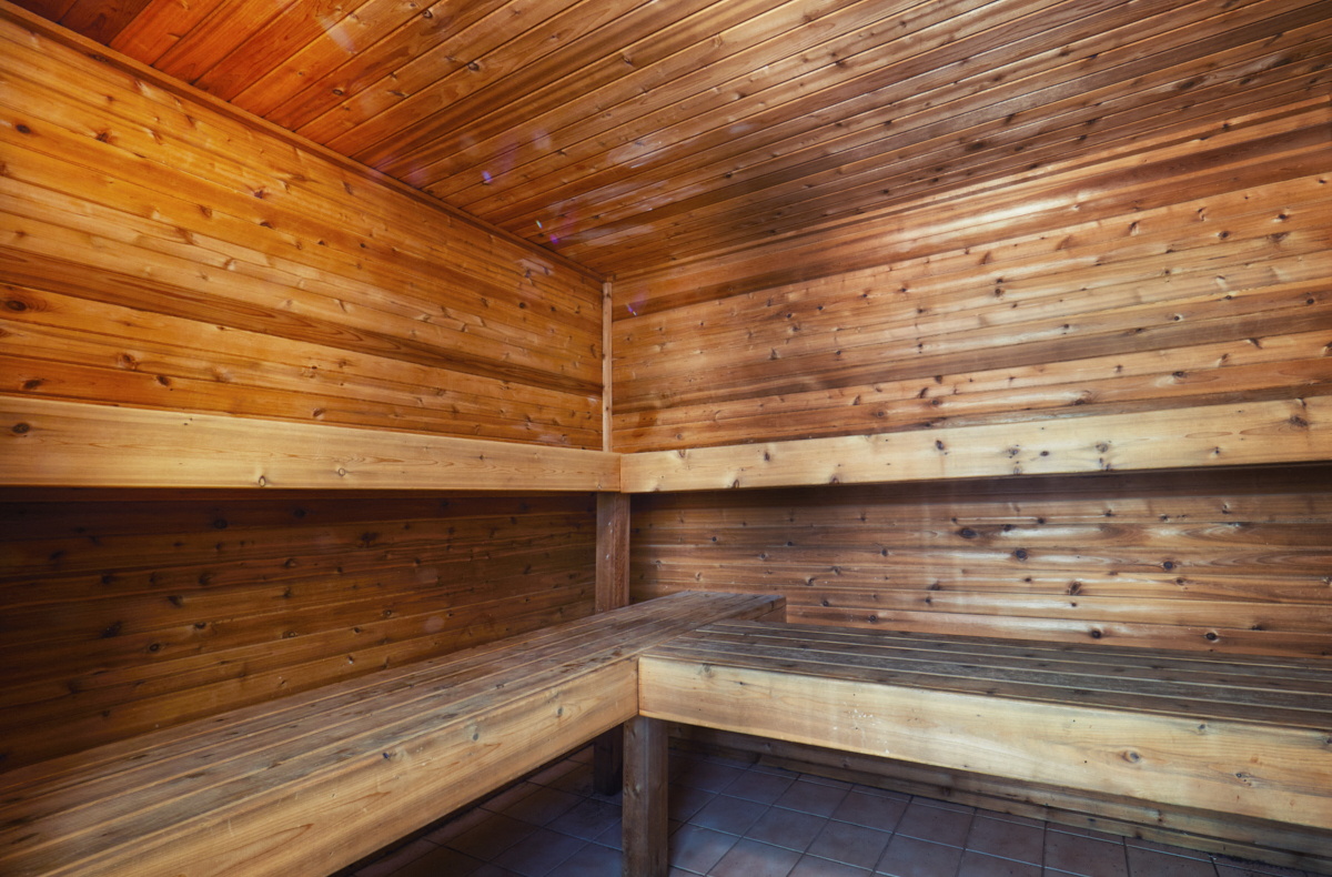 a sauna with wooden walls and wooden benches