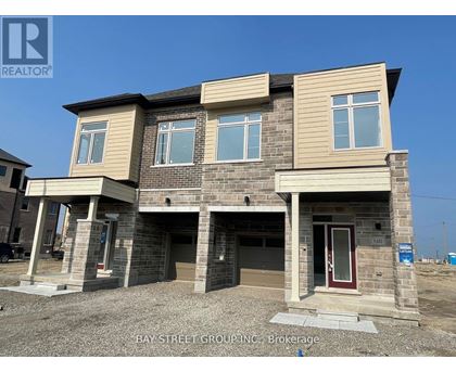 A two-story house under construction by Bay Street Group Inc.