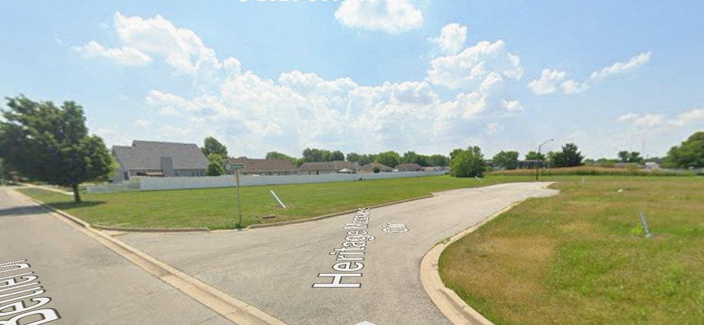 A street view with a sign that says "Hemlock".